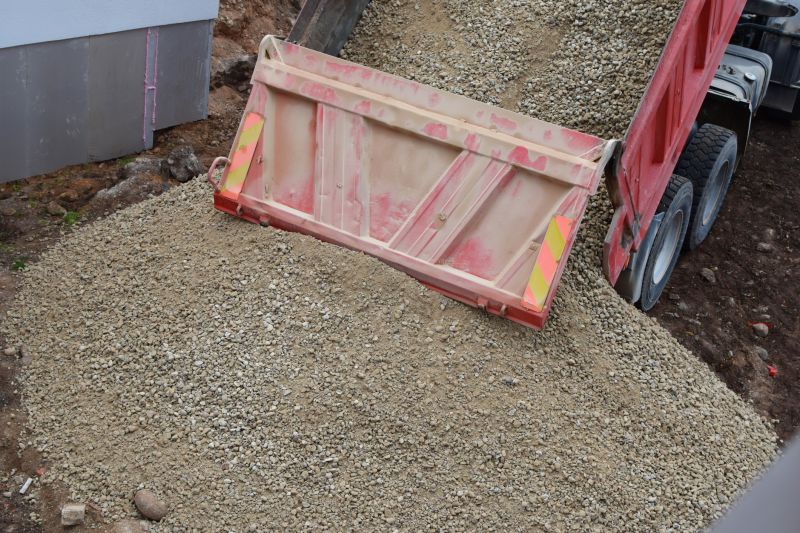 Delivery Trucks Loading Crushed Stone